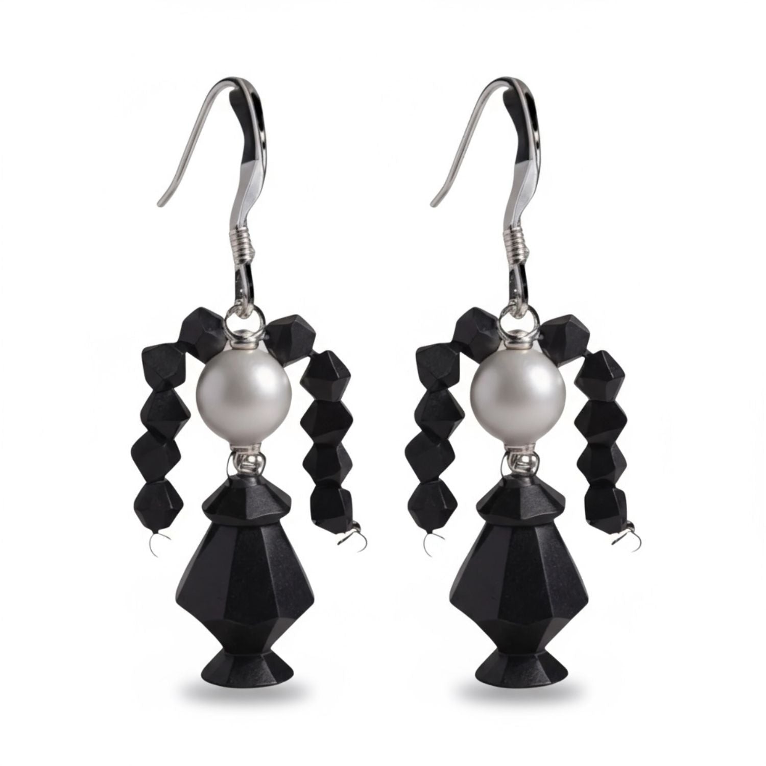 Pair of Wednesday Adams earrings with black faceted beads and a pearl on a white background