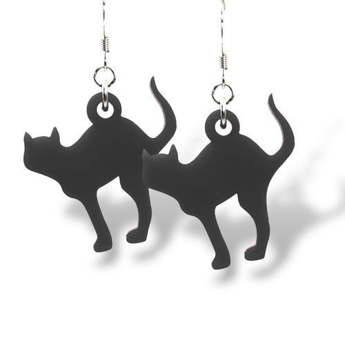 Black cat-shaped earrings on a white background
