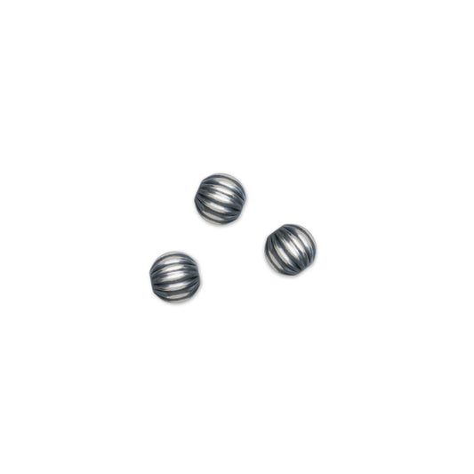 4mm Corrugated Navajo Beads on a white background.