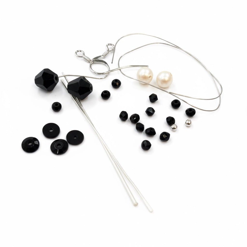 Jewelry-making supplies including beads, wires, for Wednesday Inspired earring kit.