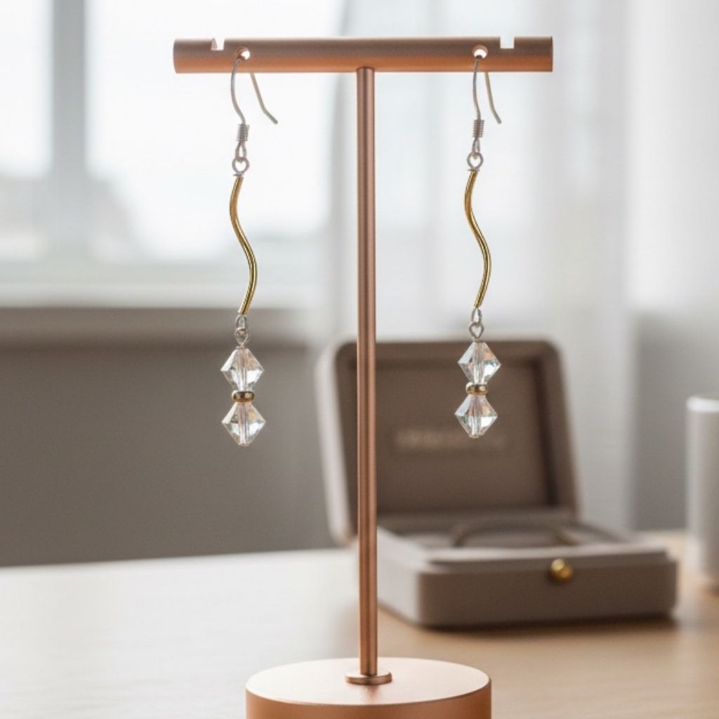 Crystal earrings on a wooden stand with a neutral background