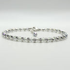 A completed bracelet made with the Endless Shimmer Bracelet Kit, featuring shimmering biconic beads, sterling silver beads, and a sterling silver clasp.