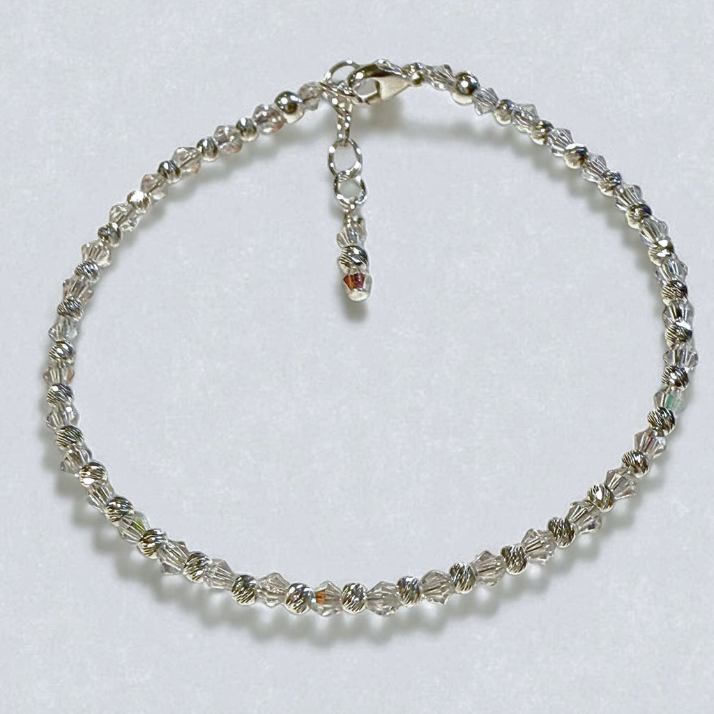 Silver beaded bracelet on a white background