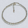 Silver beaded bracelet on a white background