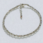 Silver beaded bracelet on a white background