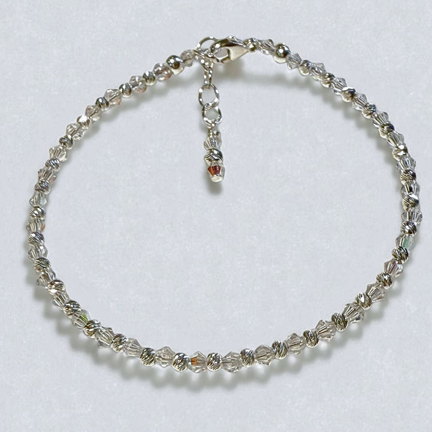 Silver beaded bracelet on a white background