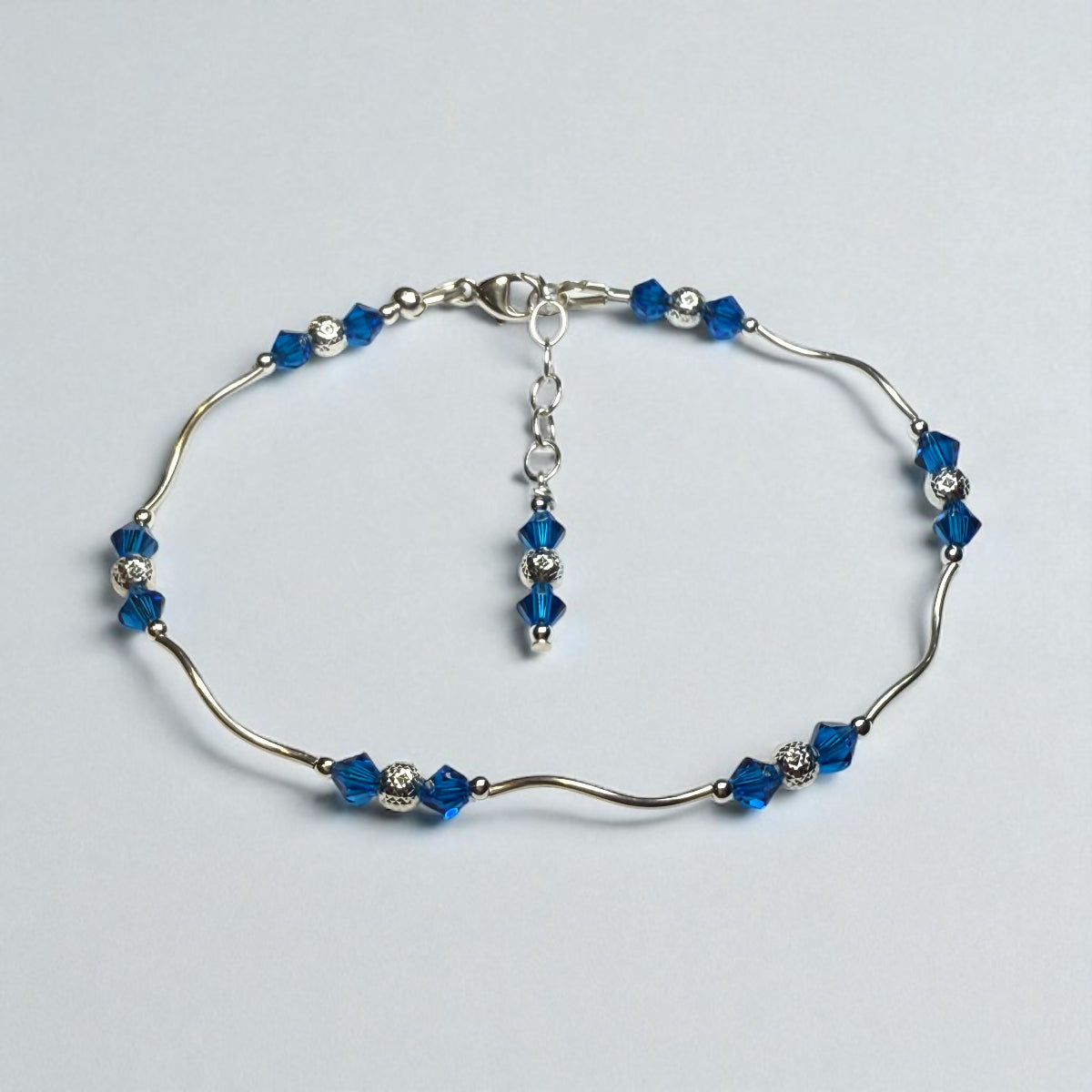 Detroit Lions assembled Silver bracelet kit with blue beads on a light gray background