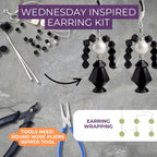 Earring-making kit with black and white earrings, tools, and instructions on a gray surface.