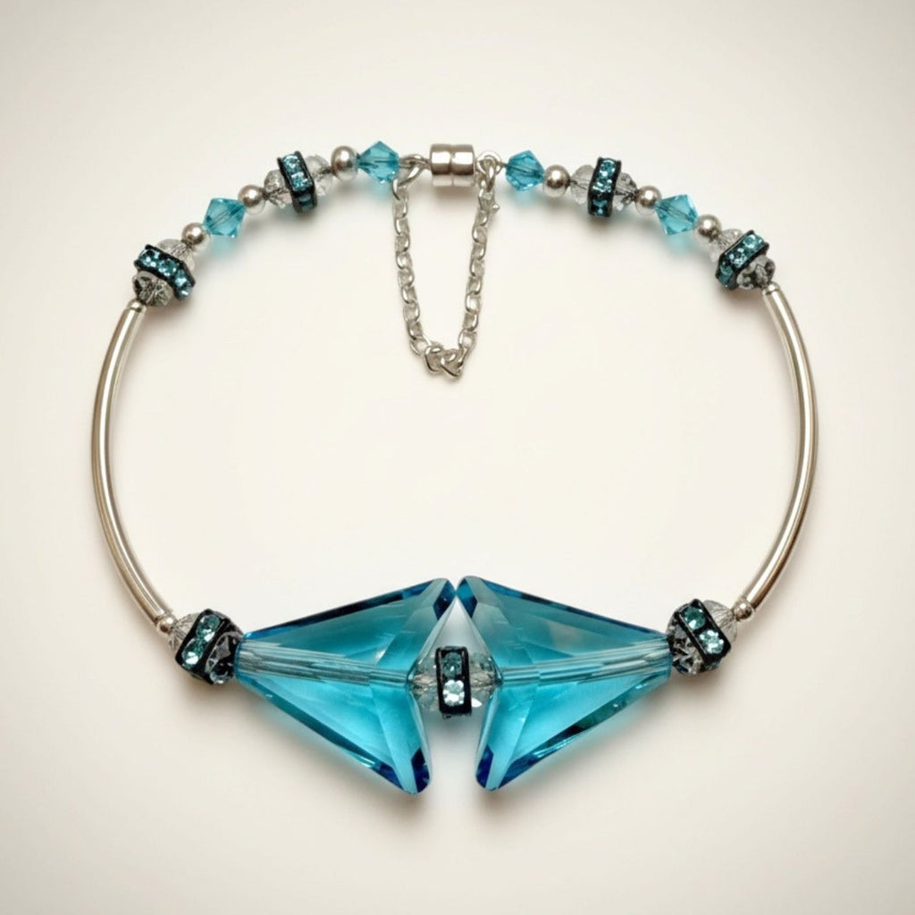 Bracelet with blue crystal arrow beads on a light background