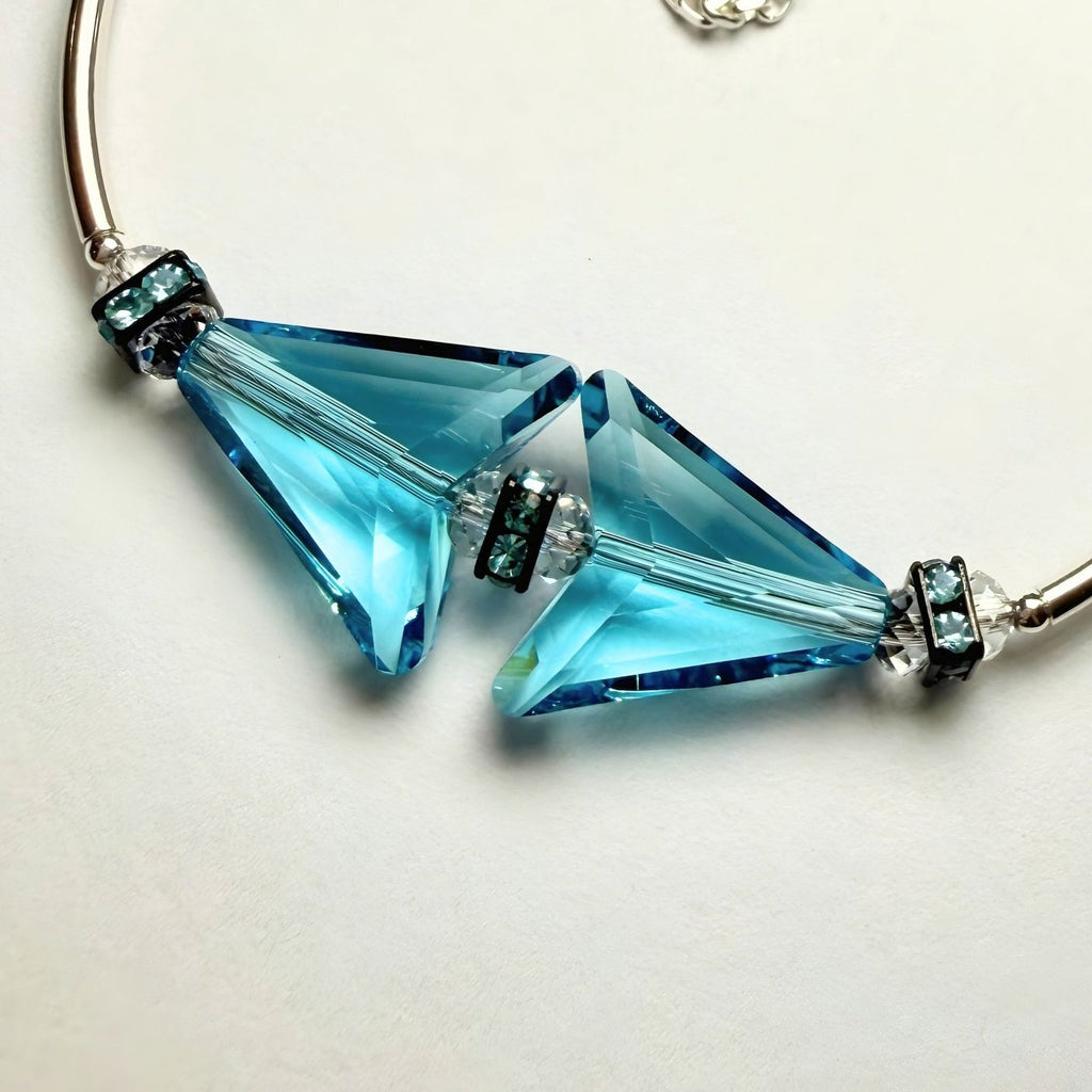 Bracelet with blue crystal beads on a white background