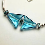 Bracelet with blue crystal beads on a white background