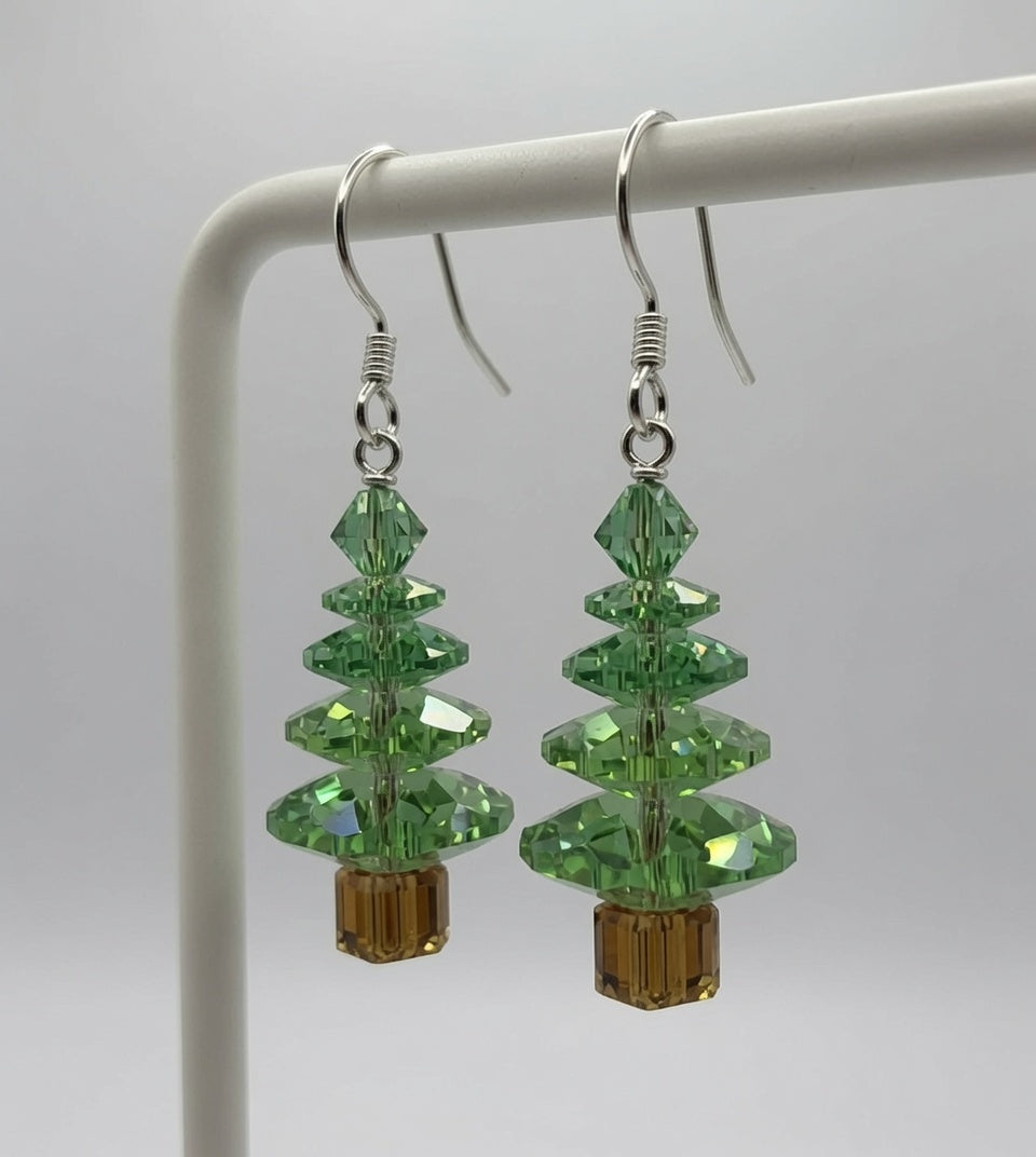 Swarovski Crystal Peridot Christmas Tree Earrings on display stand - close up