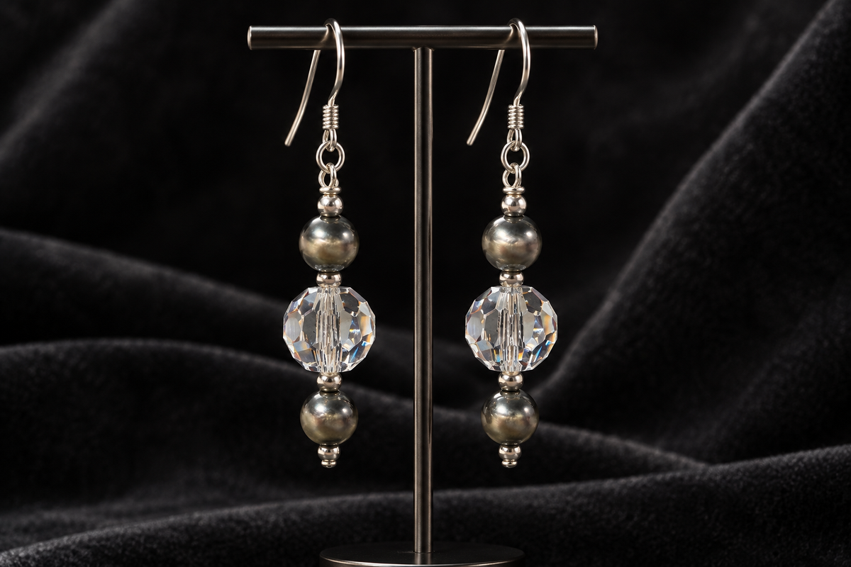 Crystal Moonlight and Navajo pearl earrings displayed against charcoal velvet