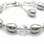 Close-up of crystal moonlight pearls, shimmer rounds, and sterling silver beads
