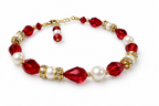 Assembled red Swarovski and pearl Christmas bracelet with gold accents on white