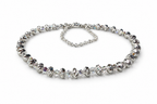 Assembled Swarovski and multicut saucer bead bracelet on a white background