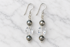 Crystal Moonlight and Navajo pearl earrings on white marble