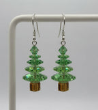 Swarovski Crystal Peridot Christmas Tree Earrings on display stand - pair view