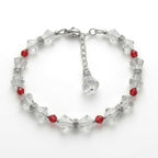 A beaded bracelet featuring faceted clear crystal beads and small red beads, arranged in a circle on a plain white background.